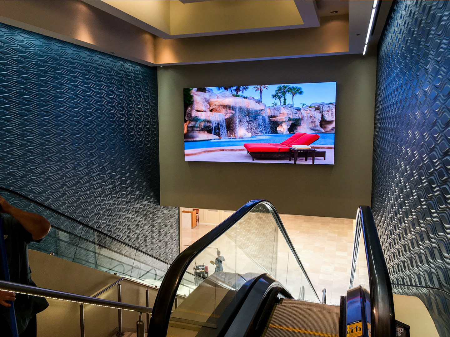 video wall above escalator